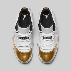 white and gold low top 11s