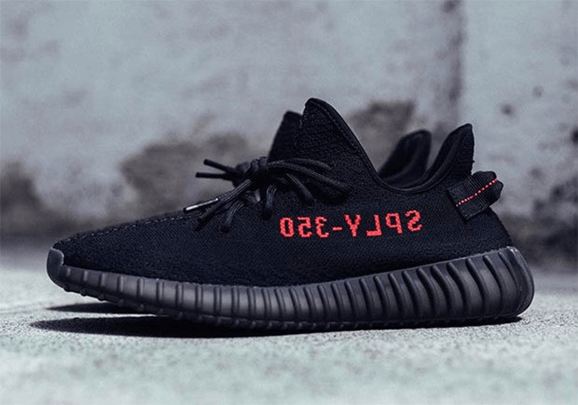 black yeezys with red writing